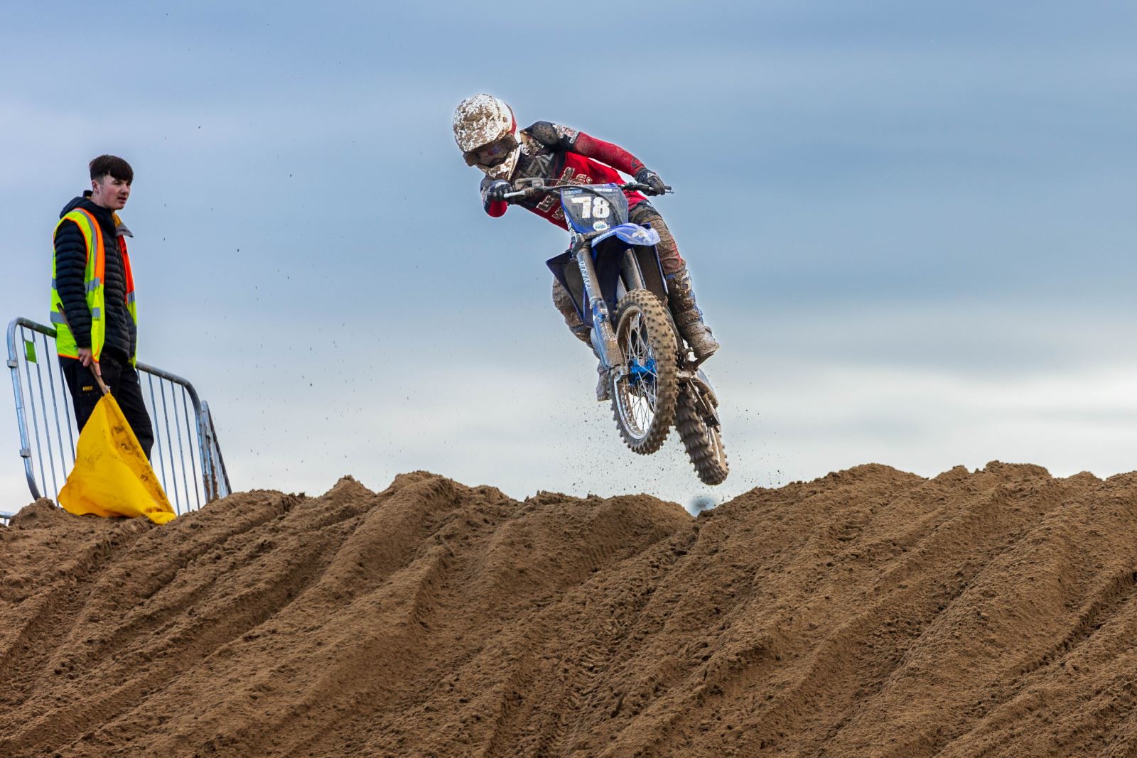 A moto cross rider flies over a jump at the Weston-super-Mare Beach Race